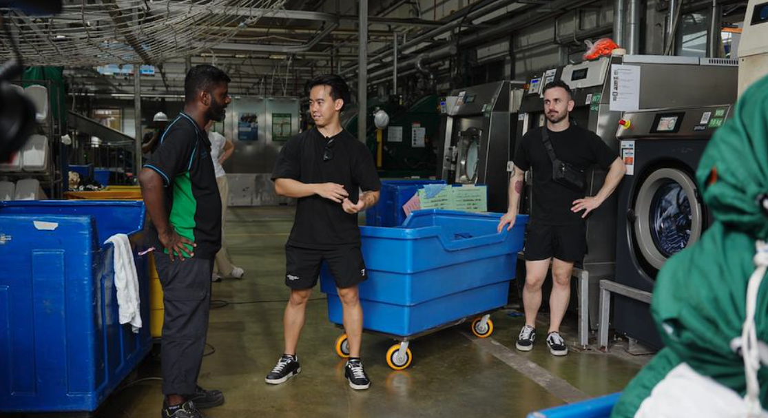 AIIMS team directing talent during the Alsco Uniforms Singapore industrial production shoot