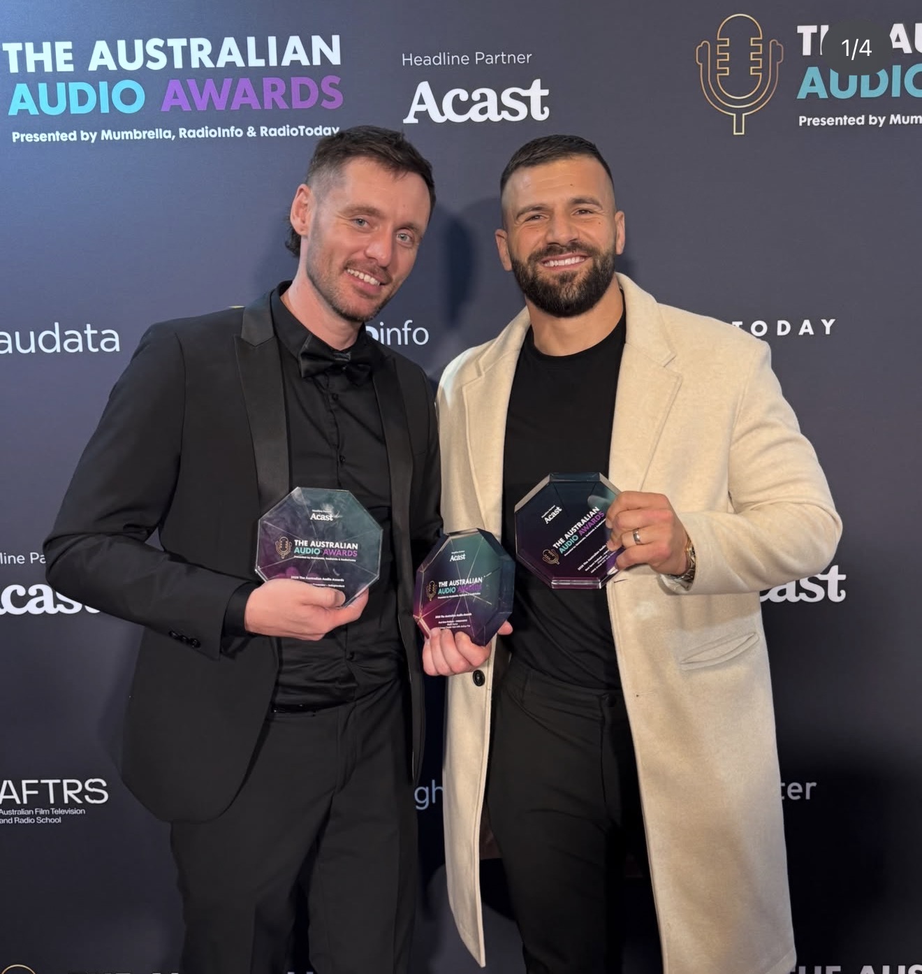 Josh Fox and Josh Mansour holding three Australian Audio Awards trophies