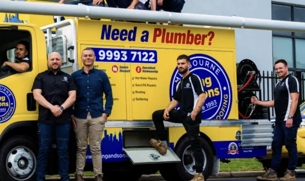 King and Sons Plumbing team beside their yellow service van