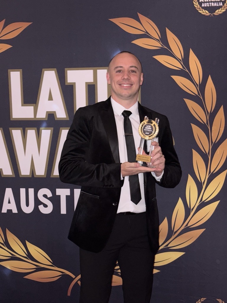 Pedro Cuccovillo Vitola holding his trophy at Latin Awards Australia 2026